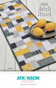 YEAR END INVENTORY REDUCTION - Mini Brick Road table runner, doll/mini quilt, and place mats sewing pattern from Atkinson Designs